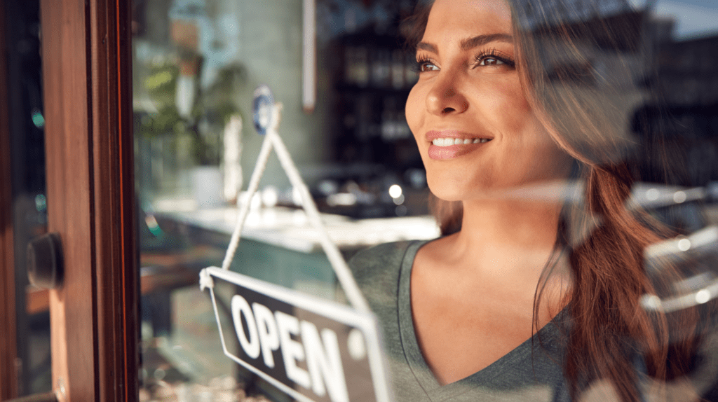 What You Need to Know Before Starting a Franchise - Woman opening a business